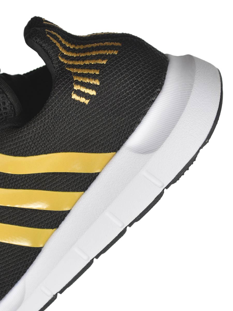 Swift run sneaker black and outlet gold